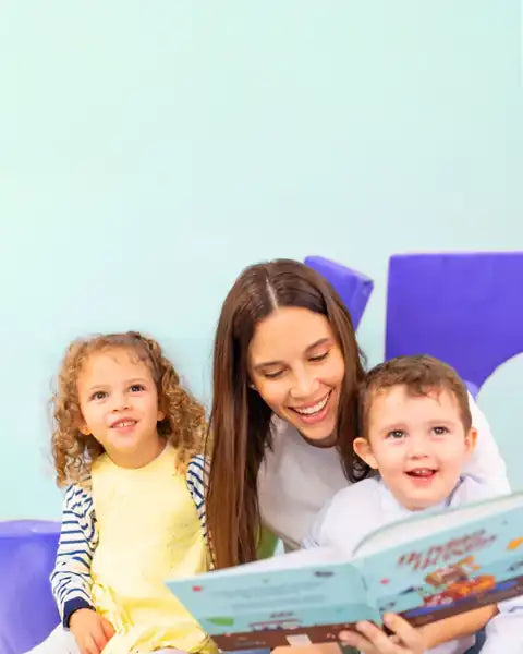 A mom reading a Crazy Little Book with two kids